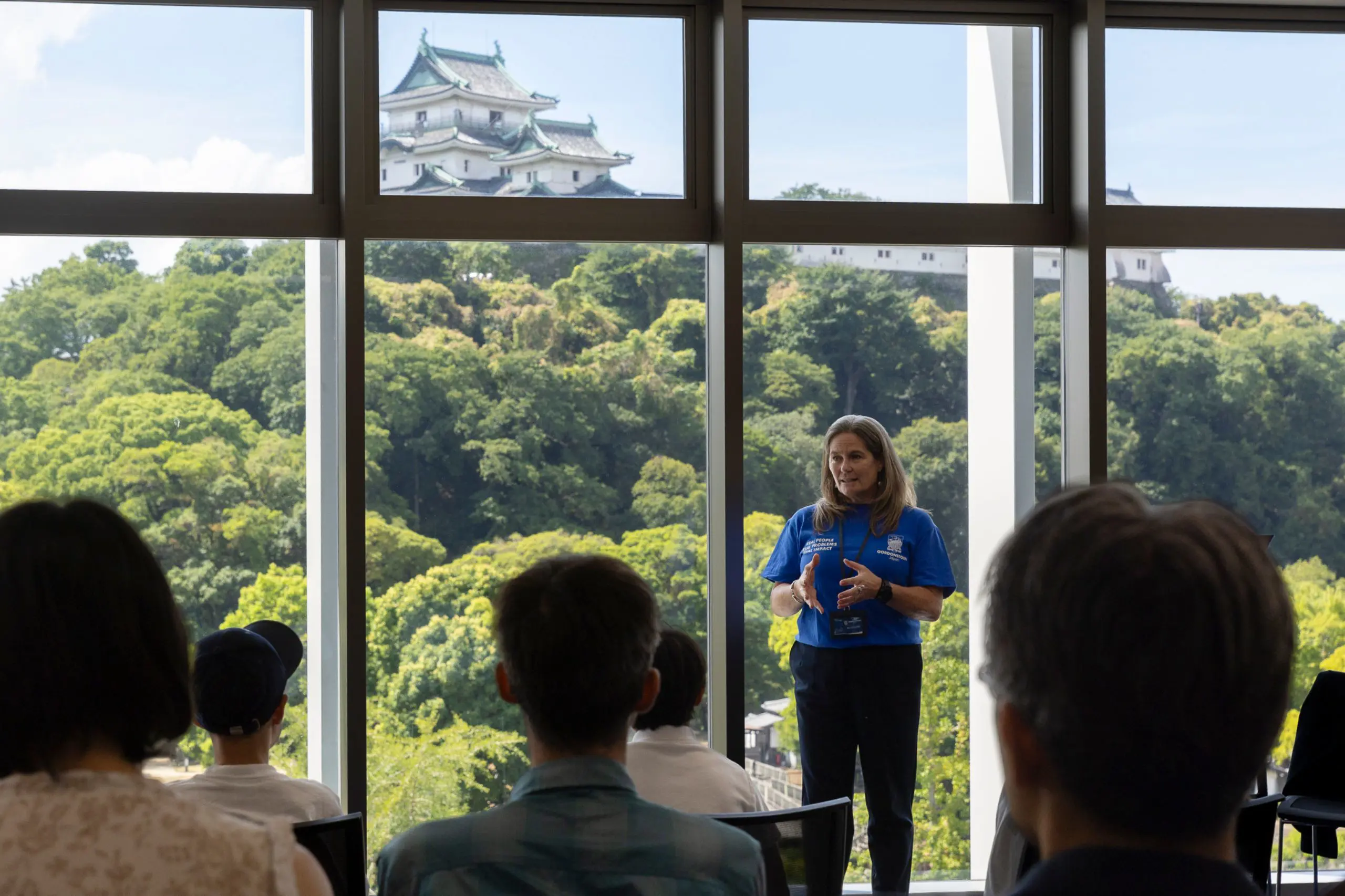 A woman presenting to a group of people